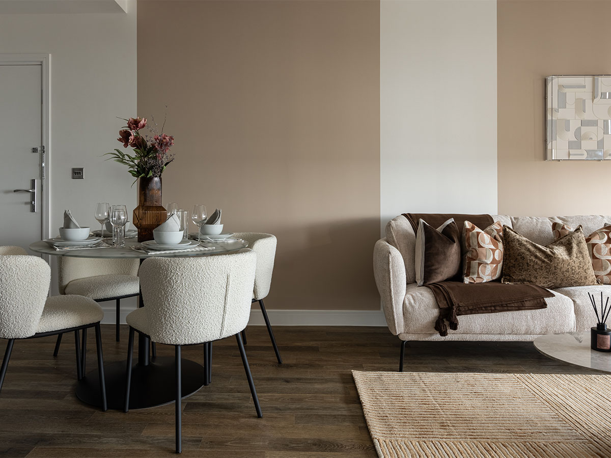 Modern dining area with a cozy beige sofa and neutral-toned decorof Coronation Square