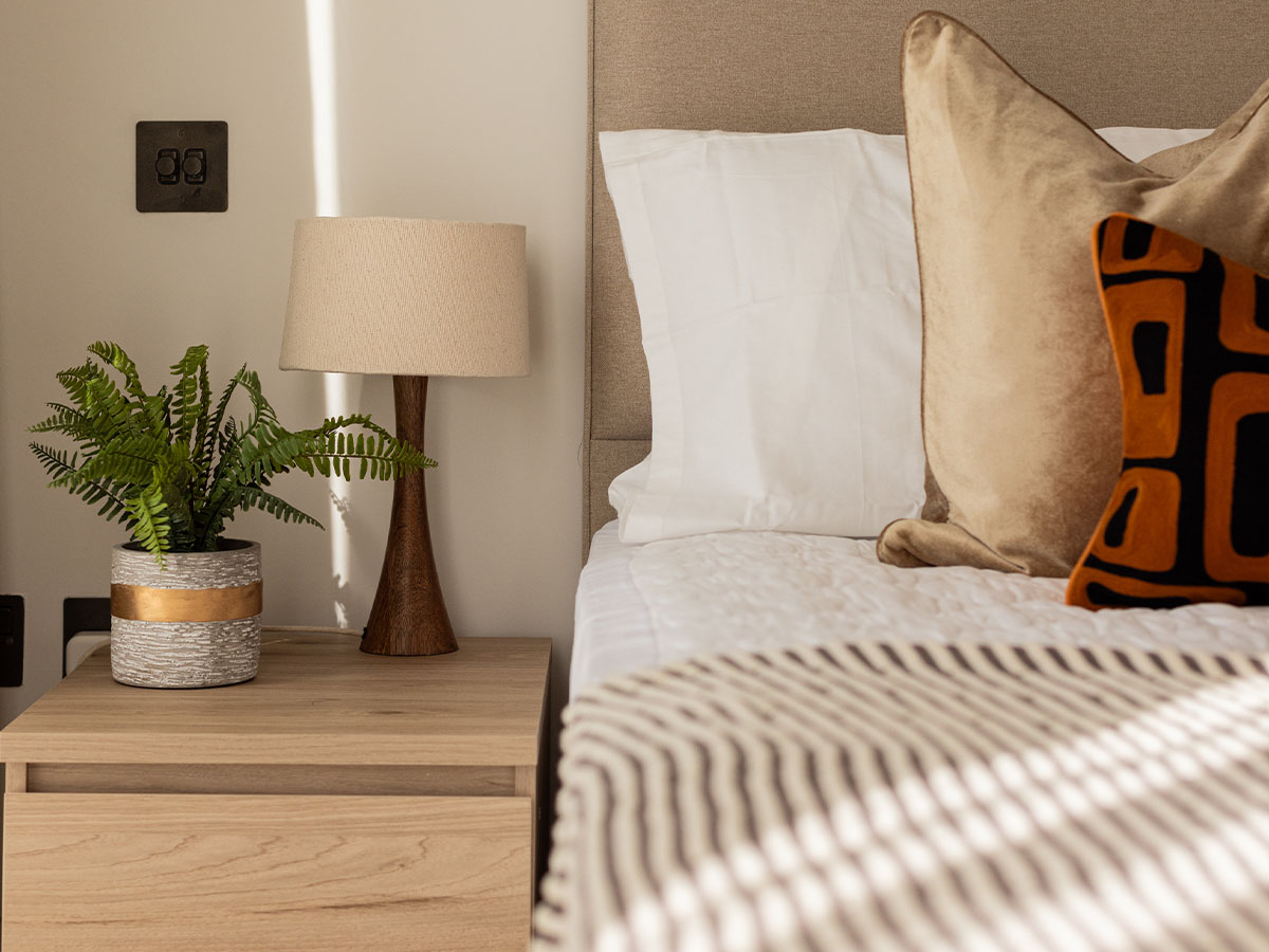 bedroom corner with a lamp, potted plant of Pembridge Gardens, Notting Hill