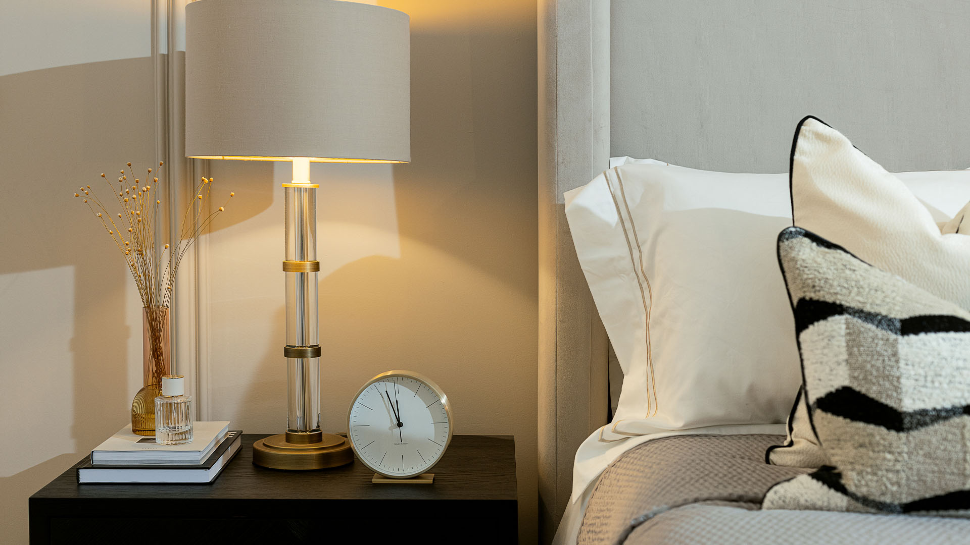 bedroom decor with modern table lamp, clock, and cozy pillows of Verdica Camden-01