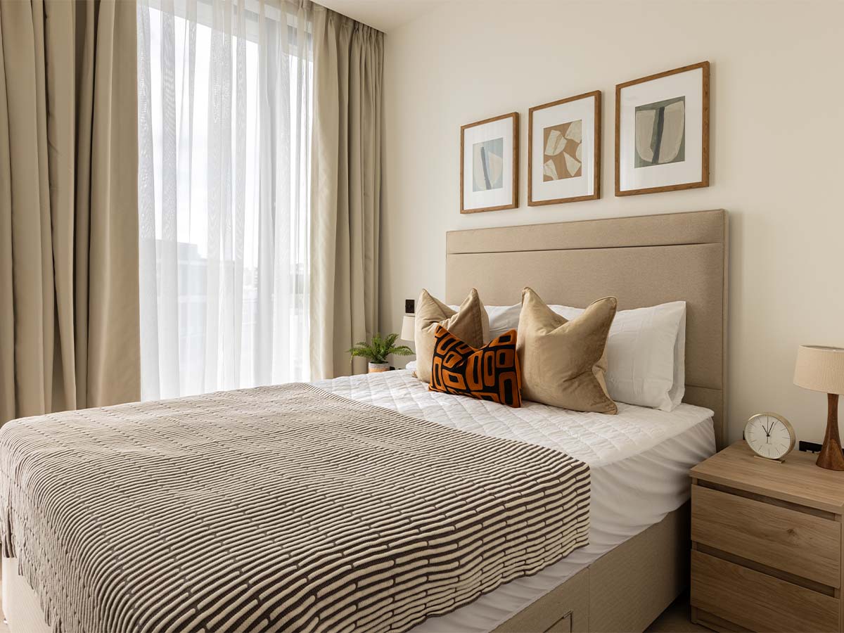 bedroom with painting and window dressing of Pembridge Gardens, Notting Hill -17