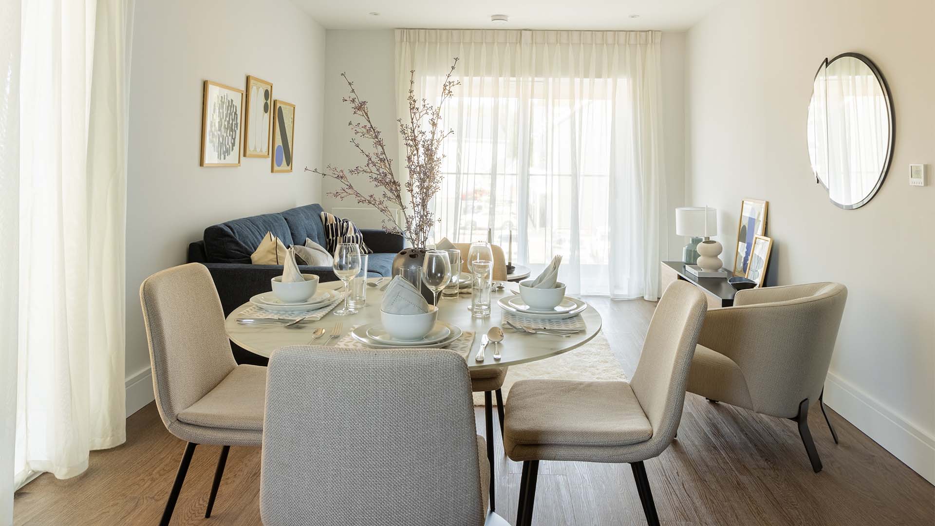 dining area with beige chairs of Green Park Village furnished by Instyle Direct