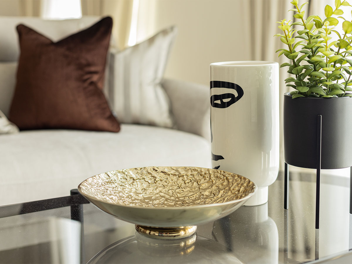 dining table with decor items in living room of Pembridge Gardens, Notting Hill