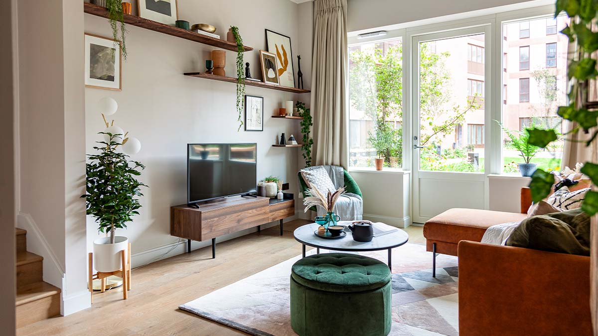 living room with large windows, sleek wooden TV stand of Carpet Street