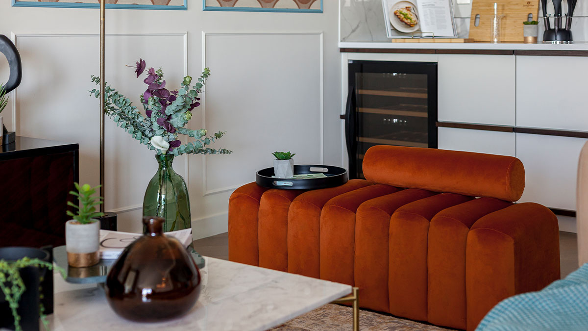 living room with an orange velvet armchair of Westmark Tower