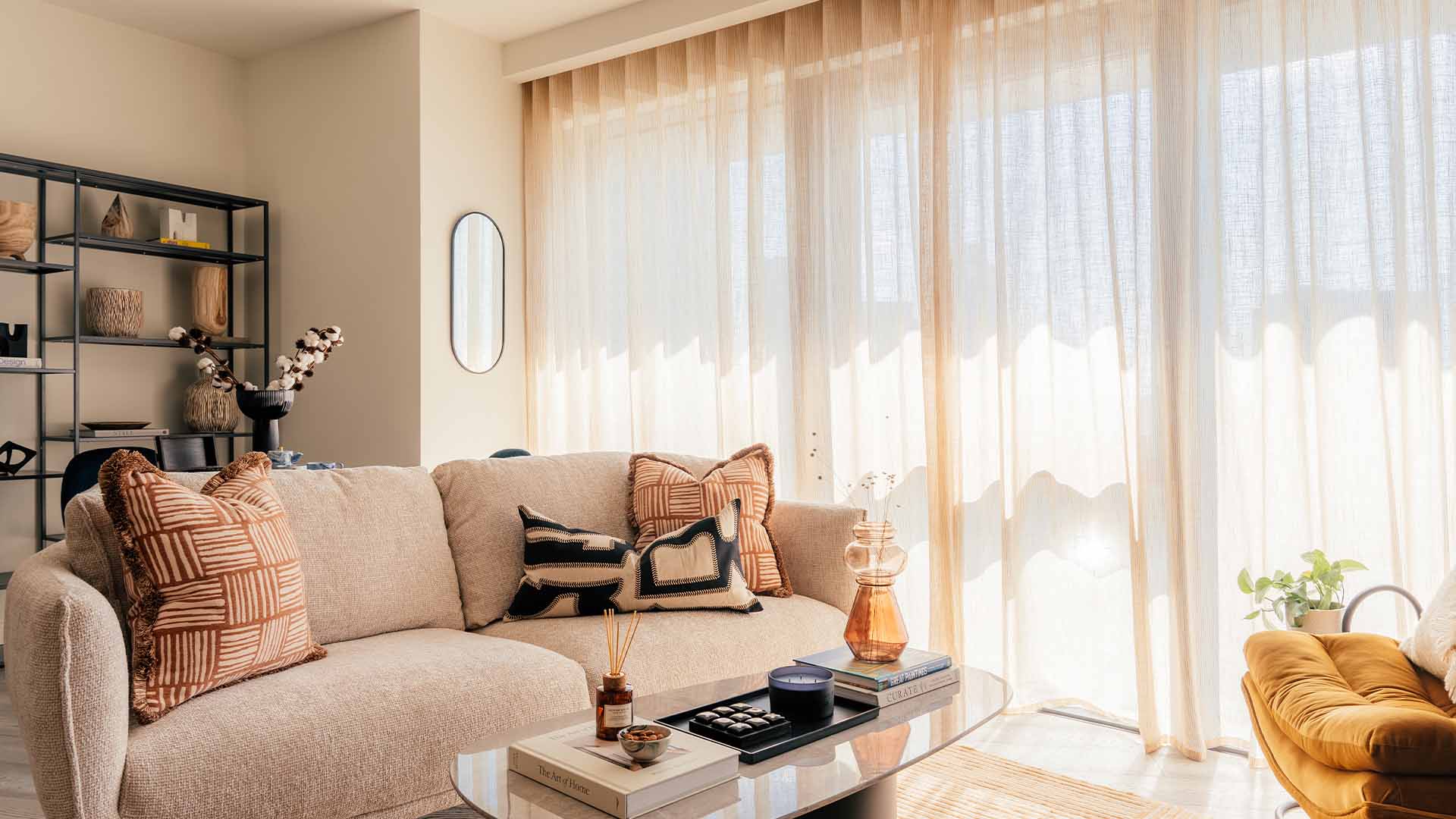 Living room with beige color of sofa, table and window dressing of Aspen-Studio-5