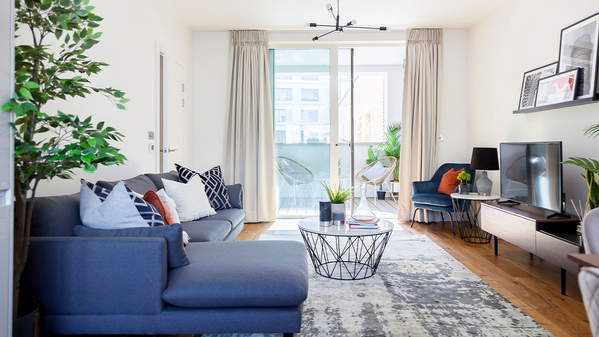 Living room with sofa and table, window dressing of Sugar House Island