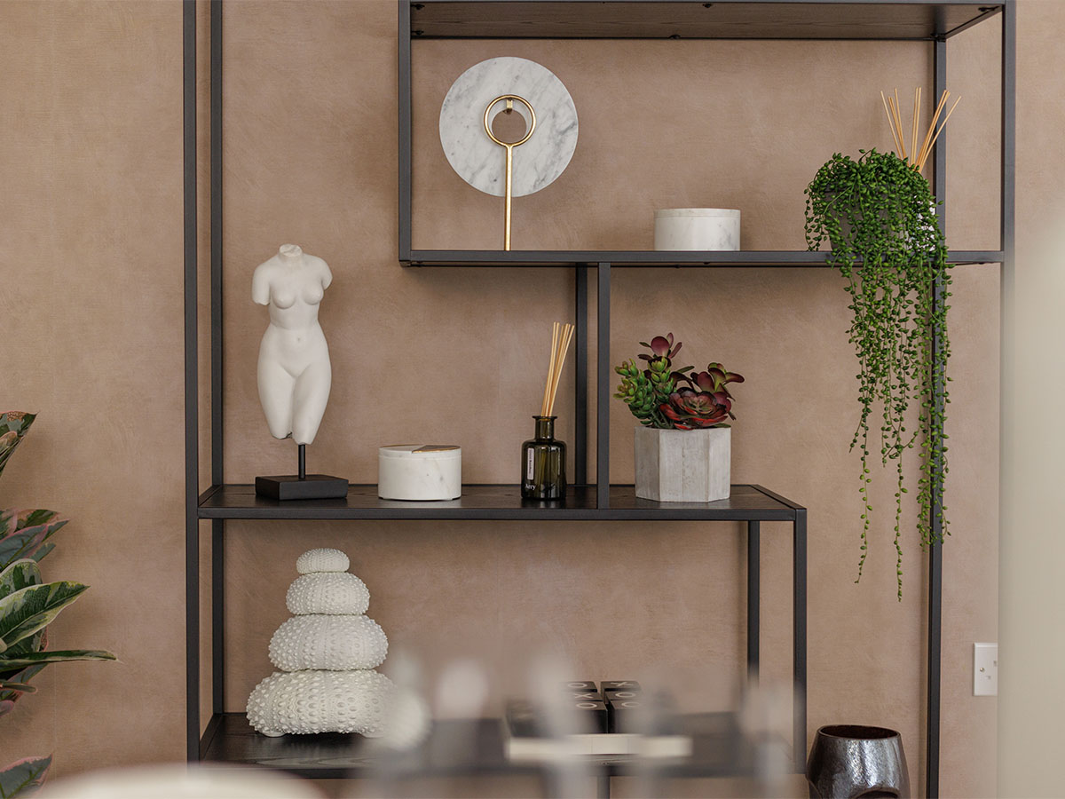 Modern shelf with art pieces, plants, and sculptures for decor of Harcourt Gardens