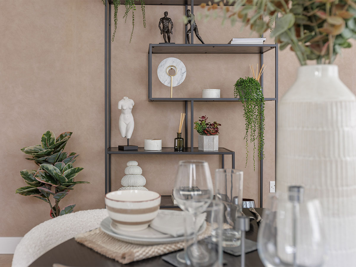 Shelf with sculptures, plants, and vases of Harcourt Gardens