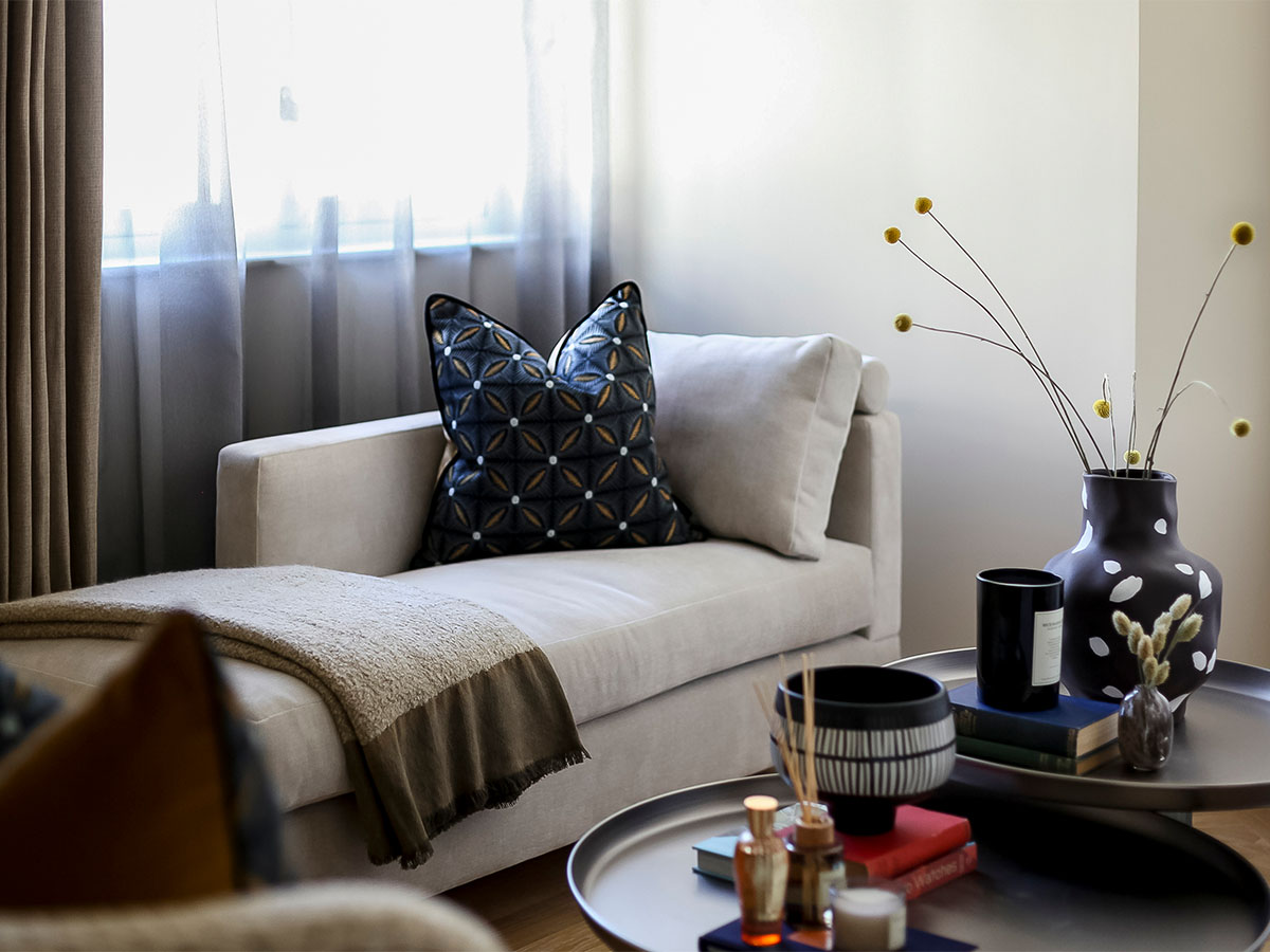 living room with chaise lounge, pillows, and coffee table of 9 Milbank