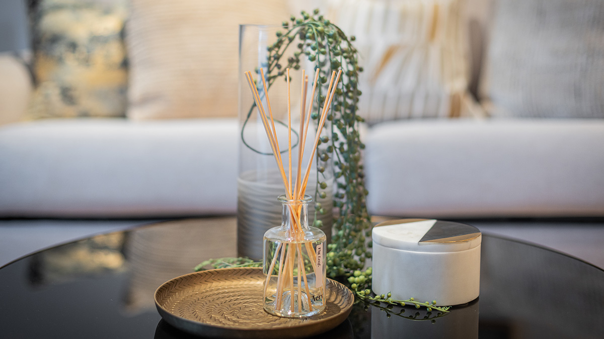 Coffee table with reed diffuser and decor of Cassini