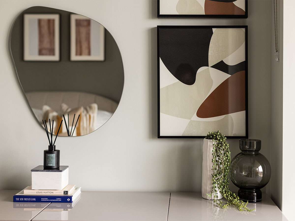 Modern bedroom with mirror, artwork, and decor of Coronation Square