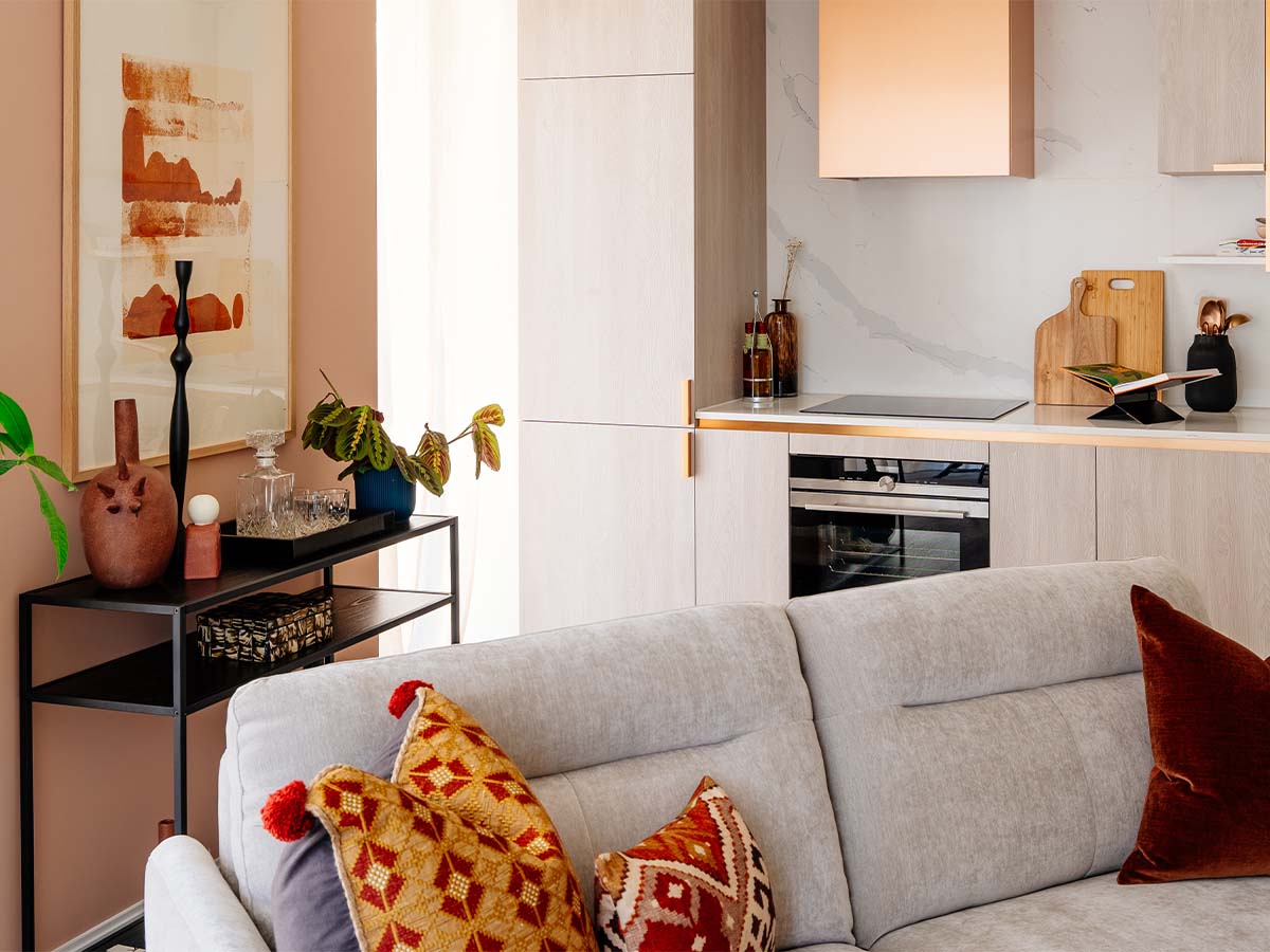 Modern kitchen and living room with pink wall of Aspen