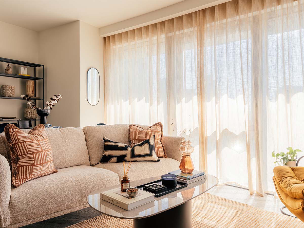 Modern living room with beige sofa and coffee table of Aspen Studio