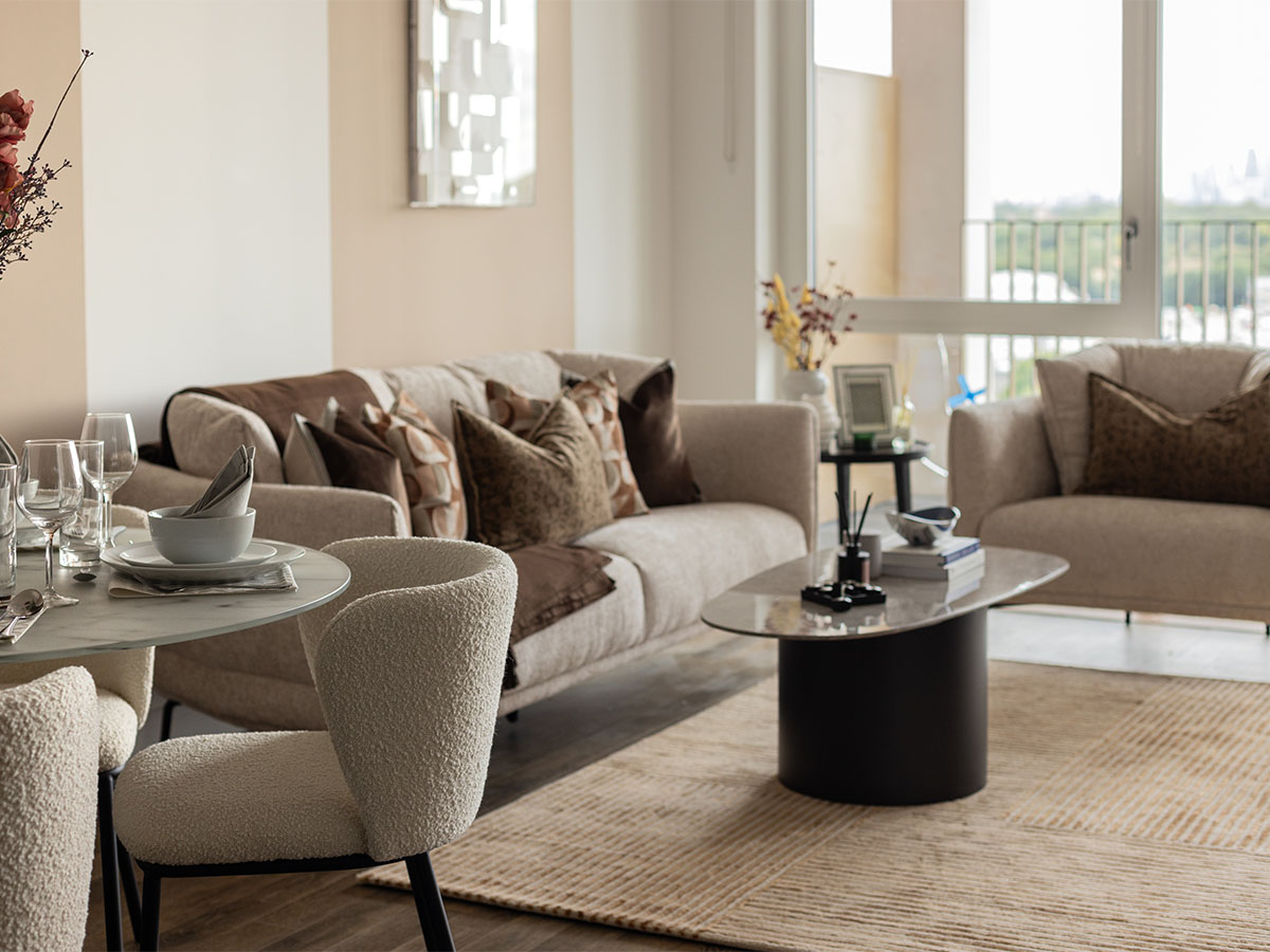 Modern living room with sofa, chairs, and coffee table of Coronation Square-08