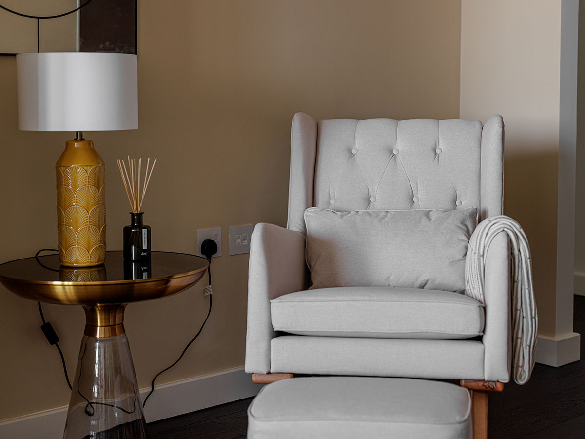 Cozy reading nook with armchair and table lamp