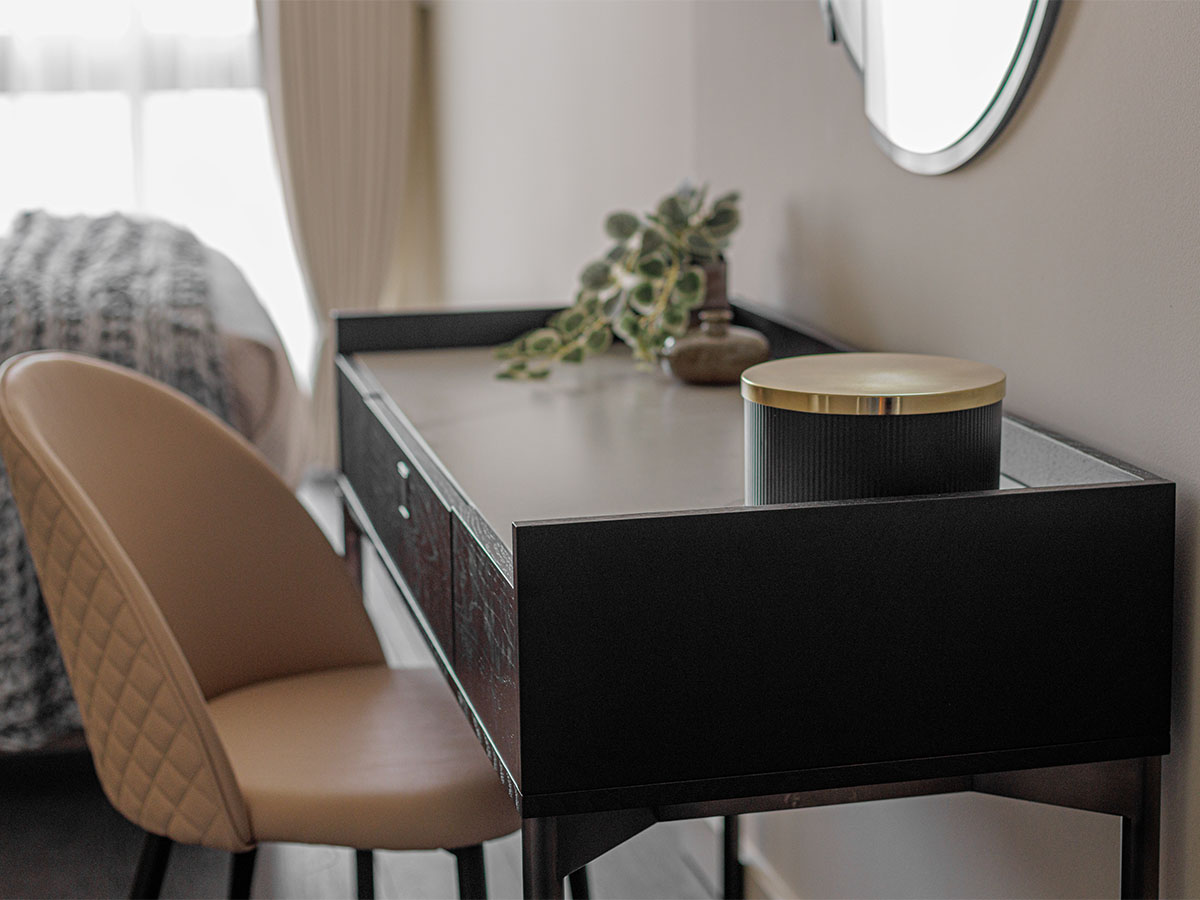 Modern vanity table with chair and gold accents