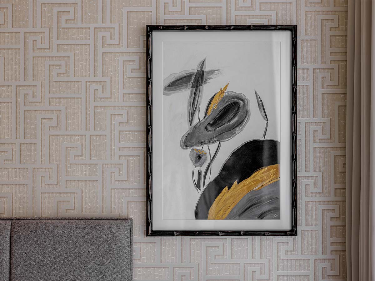 Black and white abstract art on textured wall