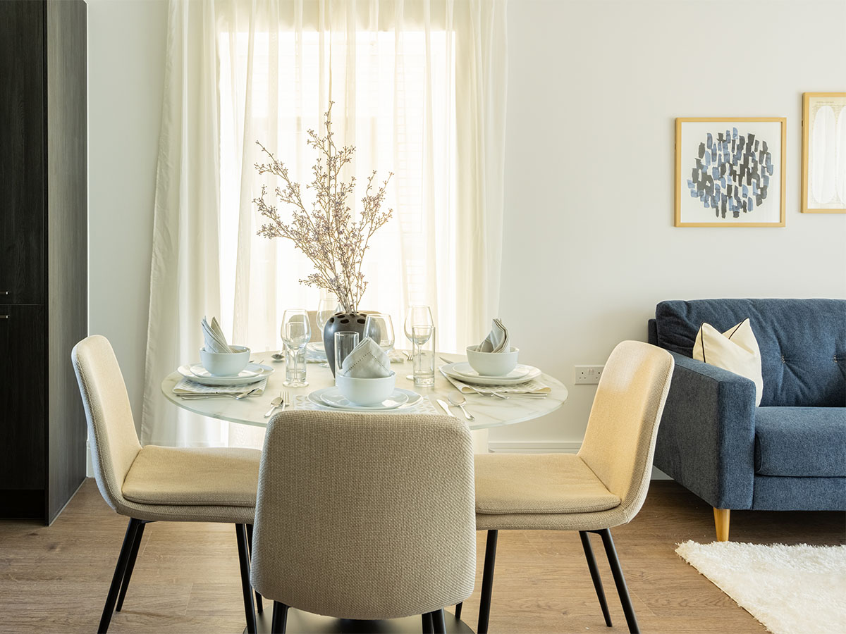 Modern dining area with round table and chairs