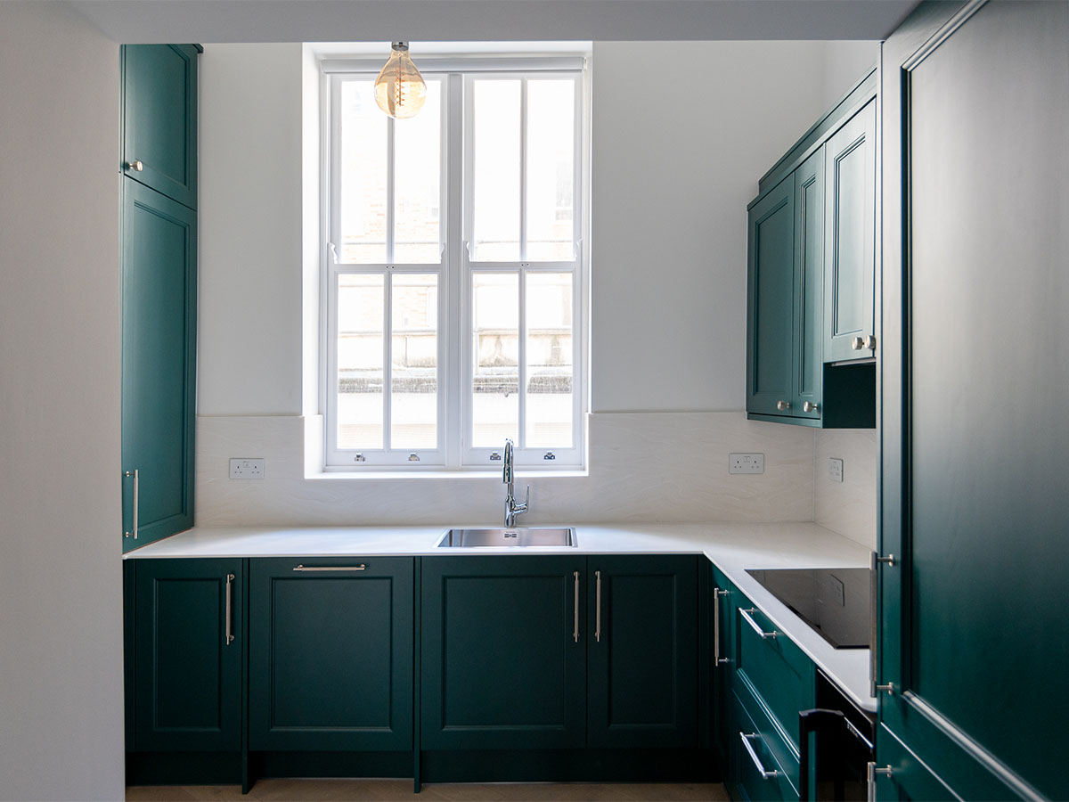 Contemporary kitchen with a large window and stylish design