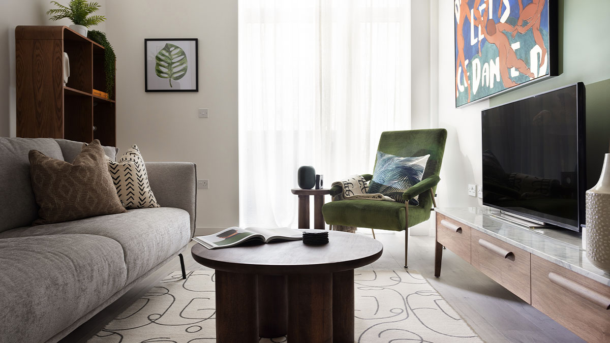 Gallions Place, Cozy living room with a sofa, armchair, TV, and coffee table