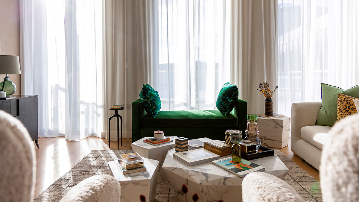 Green Velvet Sofa with Marble Coffee Tables