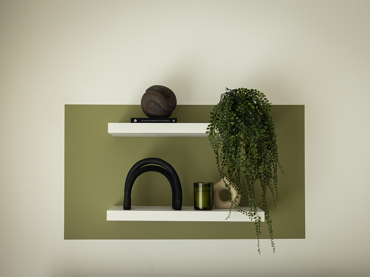 Minimalist wall decor with shelves and plants