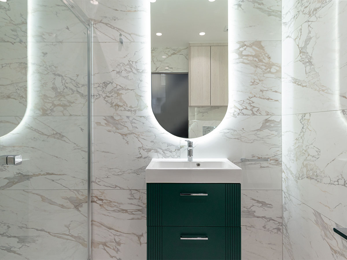 Modern bathroom with marble tiles and a vanity sink