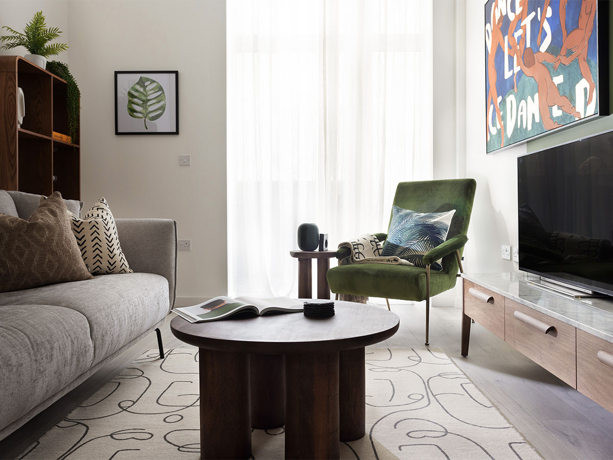 Modern living room with green armchair and sofa