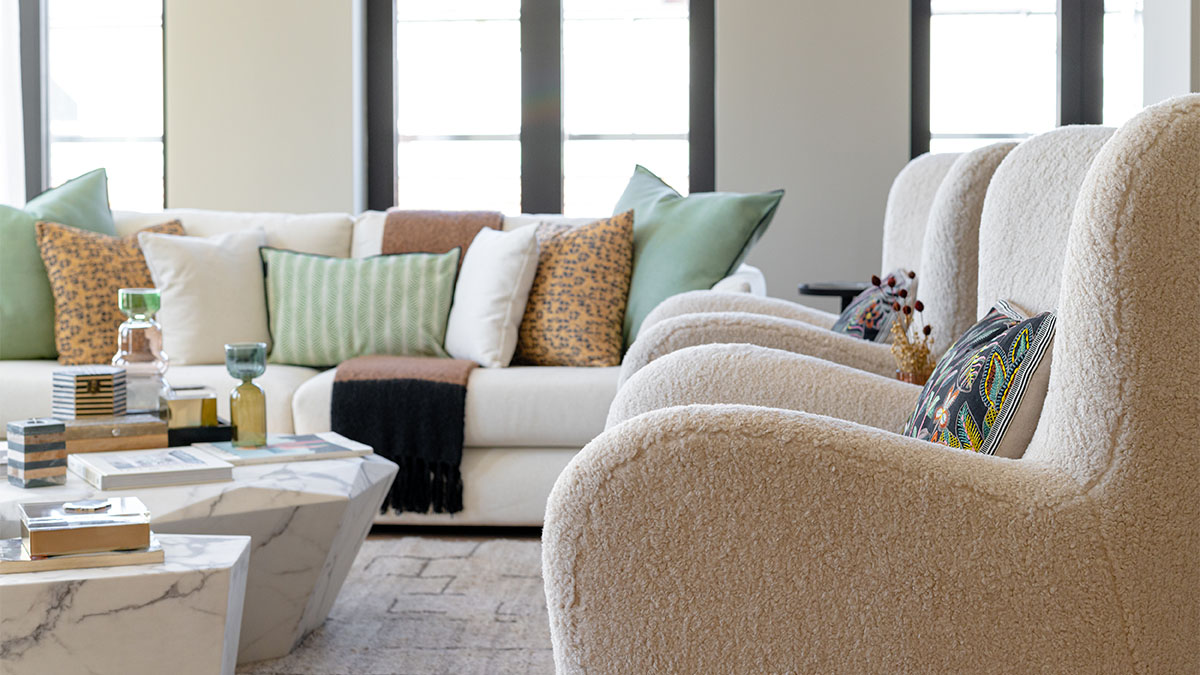 White Sofa with Colorful Pillows and Armchairs